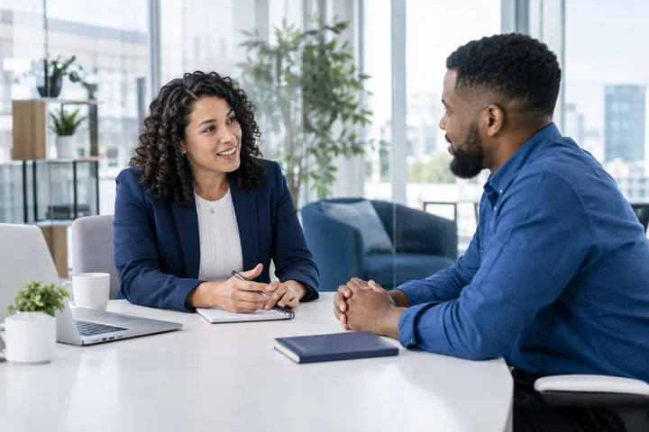 A recruiter discussing an opportunity with an applicant